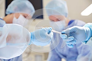 Close up of hands with scalpel at operation