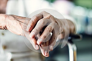 Close up hands of senior elderly woman patient