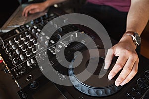 Close up of hands spinning the decks