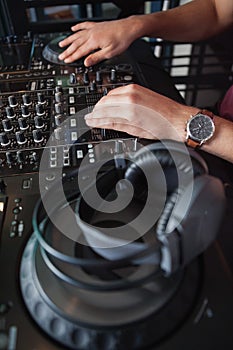 Close up of hands spinning the decks