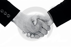 Close up of hands of two different business mans isolated on white shaking hands concept of dealing.