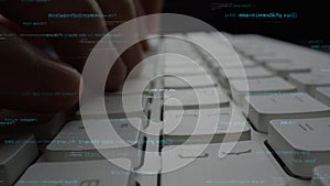 Close-up of Hands Typing on a Computer Keyboard with Abstract Programming Code and Data Overlay for Technology and
