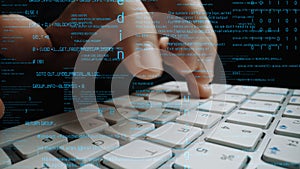 Close-up of Hands Typing on a Computer Keyboard with Code and Digital Data Overlay Representing Technology, Programming