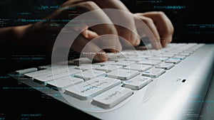 Close-up of hands typing on a keyboard with digital code and binary data overlay, symbolizing technology, coding, and