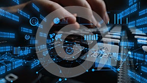 Close-Up of Hands Typing on Keyboard with Digital Data Visualization and Graphs Representing Technology and Information