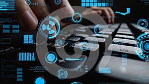 Close-Up of Hands Typing on Keyboard Surrounded by Futuristic Data Visualizations and Digital Interface Elements in a