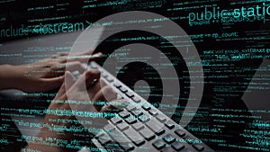 Close-Up of Hands Typing on Keyboard Surrounded by Lines of Code in Dark Environment, Representing Programming and