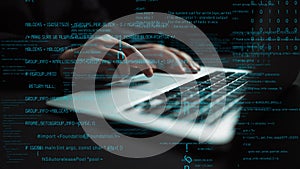 Close-Up of Hands Typing on Laptop with Code in Background and Digital Data Overlay for Technology and Programming