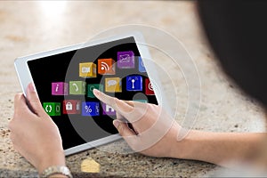 Close up of hands using tablet with graphics on screen