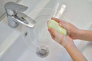 Close up of hands washing with soap. Washing hands with soap under the faucet with water. Clean and hygiene concept