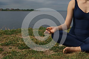 Close up hands. Woman do yoga outdoor. Concept Yoga