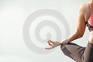 Close up hands. Woman do yoga relax outdoor. Woman exercising pose