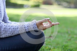 Close up hands. Woman do yoga relax outdoor. Woman exercising pose vital and meditation for fitness lifestyle club at the outdoors