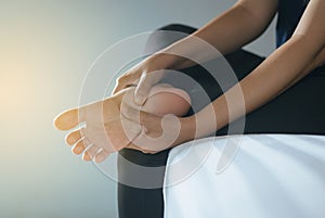 Close up of hands woman having a foot sole pain,Female feeling exhausted and painful