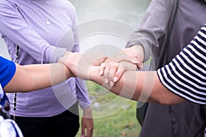 Close up of hands woman putting with stack or hand touching and showing successful teamwork together outdoor