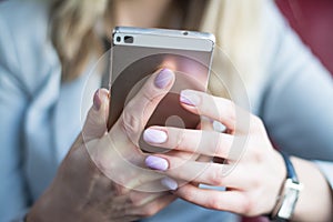 Close up of hands woman using cell phone
