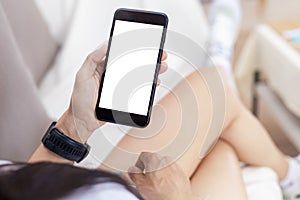 Close up hands of woman using mobile phone, cell phone in coffee shop. Hands of women holding blank empty screen smart phone in