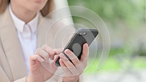 Close up of Hands of Young Businesswoman using Smartphone