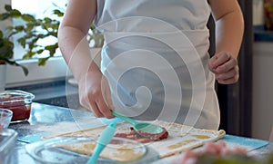 Young chef cooking pizza