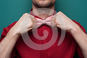 Close-up of the hands of a young man in red shirt photo