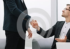 Close up. handshake of business partners on a light background