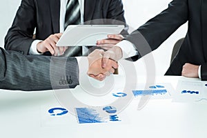 Close up handshake of business people in meeting attendance