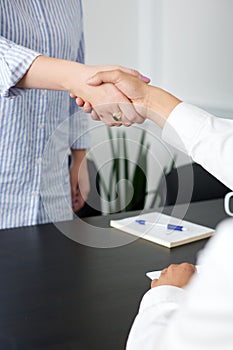 Close up of handshake in the office