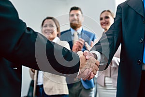 Close-up of the handshake of two business men after an important agreement