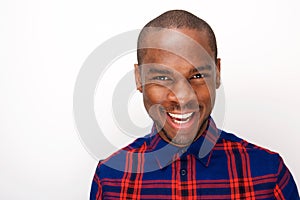 Close up handsome black man smiling against isolated white background