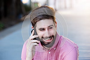 Close up handsome caucasian man talking on mobile phone