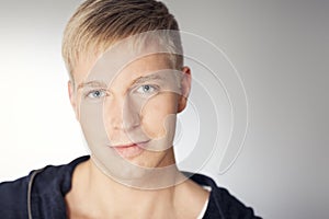 Close up of handsome man with charming calm look.