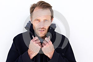 Close up handsome man keeping warm with jacket