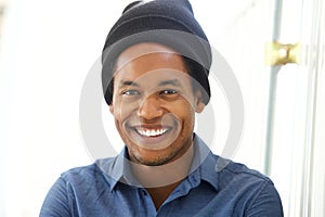 Close up handsome young african american man smiling with beanie