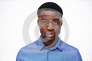 Close up handsome young black man against isolated white background