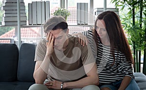 Close up handsome young man An anxious, worried, and bored look on his face. It May be caused by depression get consolation A hug