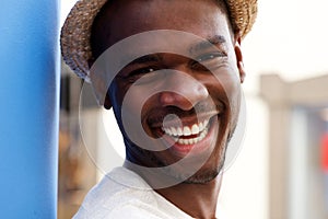 Close up handsome young man smiling outdoors