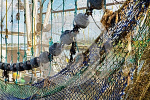 Close-up of a hanging fishing net on a fishing boat