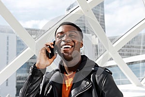 Close up happy african american man with cellphone in the city