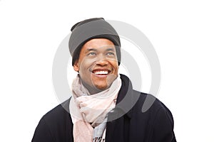 Close up happy african american man dressed warm in winter jacket beanie and scarf
