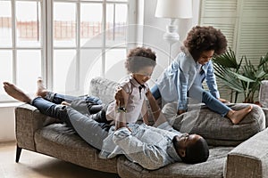 Close up happy African American man with kids having fun