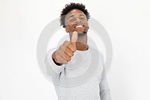 Close-up of happy African American man showing thumb up