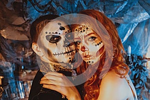 Close up of happy couple in Halloween Costume and Makeup. Bloody theme: the crazy maniak faces