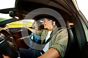 Close up happy couple sightseeing on road trip together