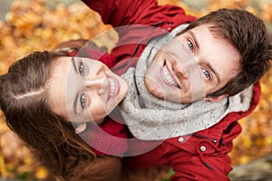 Close up of happy couple taking selfie at autumn