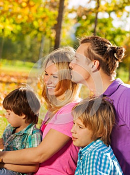 Close-up of happy family sitting together in hug