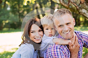 Close-up of happy family spending time together in the park