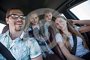Close up. happy family travels in a comfortable car