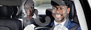 Close-up Of Happy Male Chauffeur Driving Car