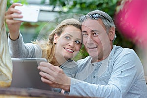 close-up happy middle-aged couple taking selfie