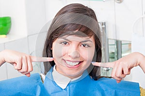 Close-up of happy patient in dentistry office smiling